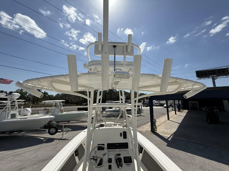 Slide: The Image of 2025 Pathfinder 2400 Open boat with T-top under clear blue sky. - 8