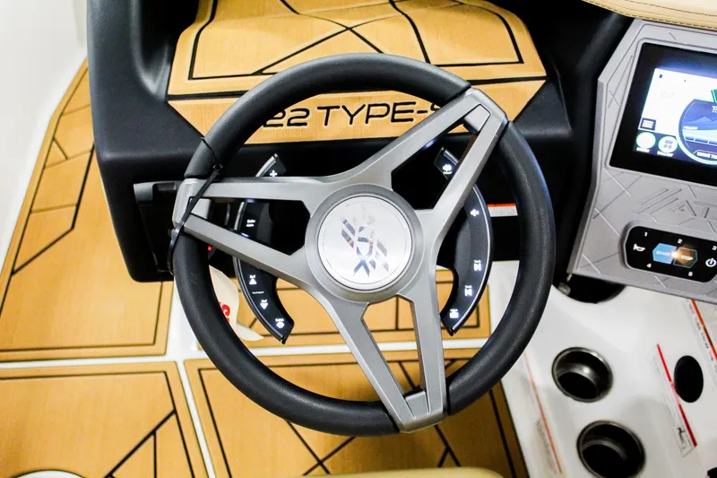 Slide: The Image of Steering wheel of 2025 ATX Surf Boats 22 Type-S with modern dashboard design. - 15