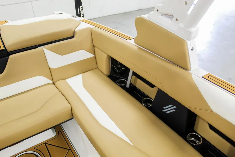 Slide: The Image of 2025 ATX Surf Boats 22 Type-S interior with tan and white seating. - 18