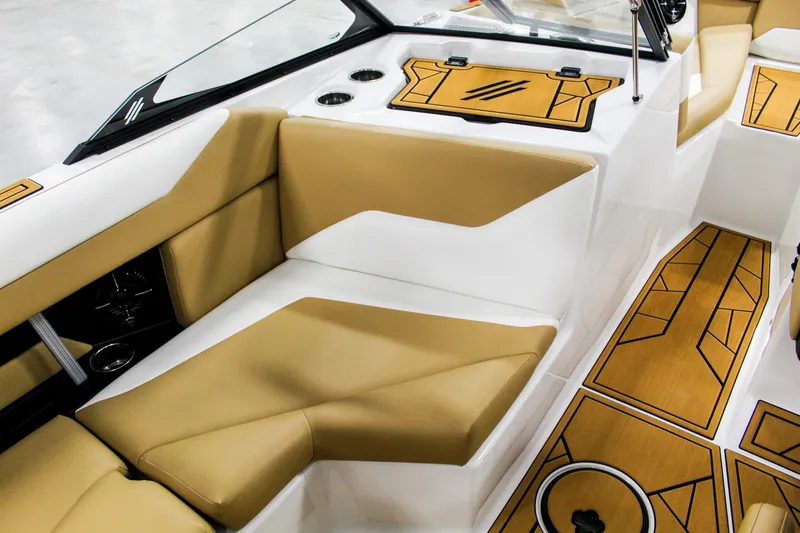 Slide: The Image of 2025 ATX Surf Boats 22 Type-S interior with tan and white seating, modern design. - 19