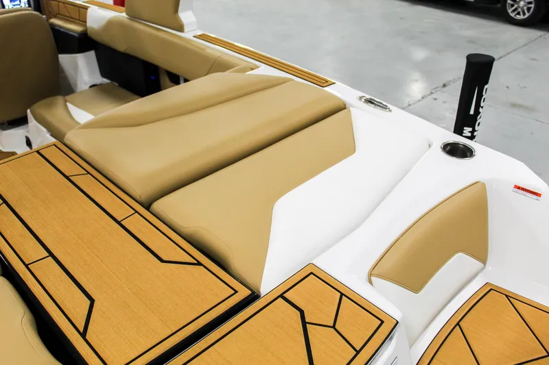 Slide: The Image of 2025 ATX Surf Boats 22 Type-S interior with tan and white seating, modern design. - 25
