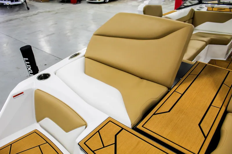 Slide: The Image of 2025 ATX Surf Boats 22 Type-S interior with tan seating and stylish wood accents. - 27