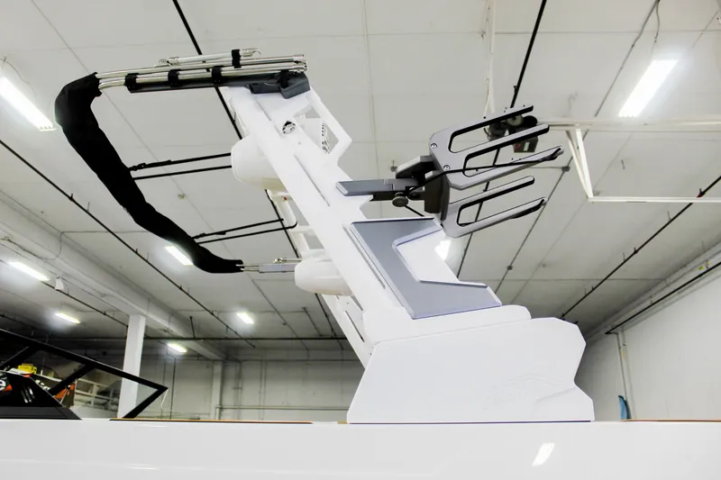 Slide: The Image of 2025 ATX Surf Boats 22 Type-S wakeboard tower in a showroom setting. - 28