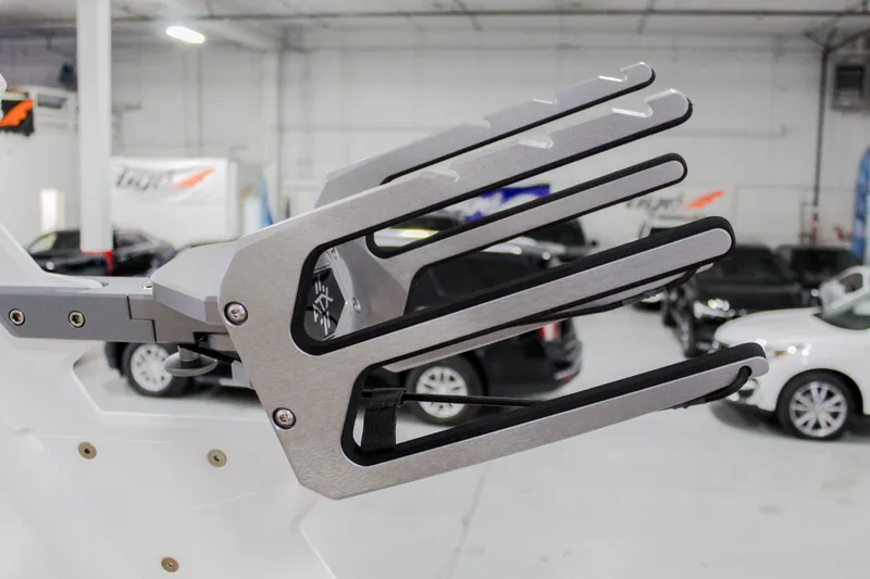 Slide: The Image of Wakeboard rack on 2025 ATX Surf Boats 22 Type-S, in a showroom setting. - 29