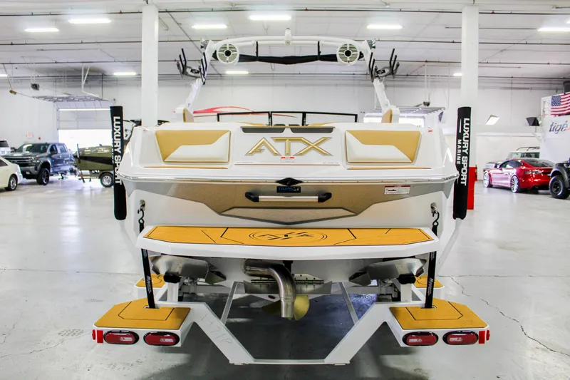Slide: The Image of 2025 ATX Surf Boats 22 Type-S in showroom, rear view, showcasing design and features. - 3