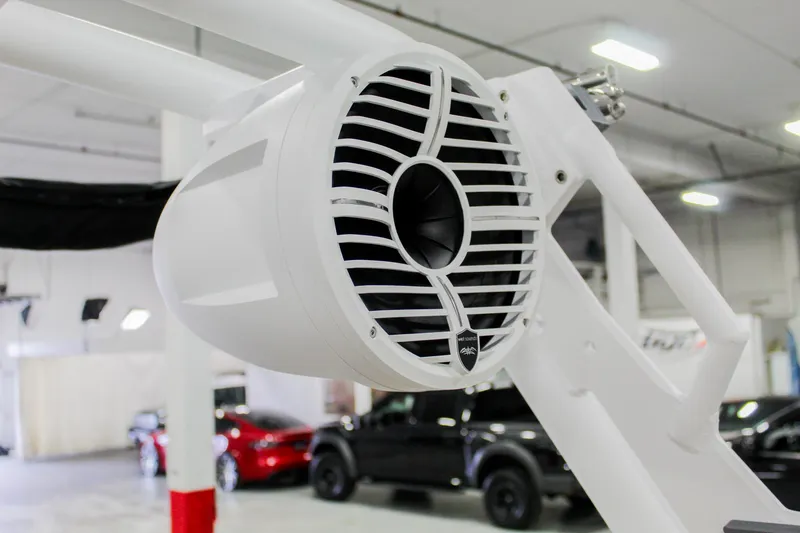 Slide: The Image of 2025 ATX Surf Boats 22 Type-S speaker detail in a showroom setting. - 30