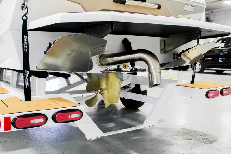 Slide: The Image of 2025 ATX Surf Boats 22 Type-S rear view, showcasing propeller and exhaust system. - 32