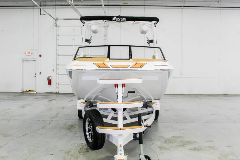 Slide: The Image of 2025 ATX Surf Boats 22 Type-S on trailer in warehouse setting. - 4