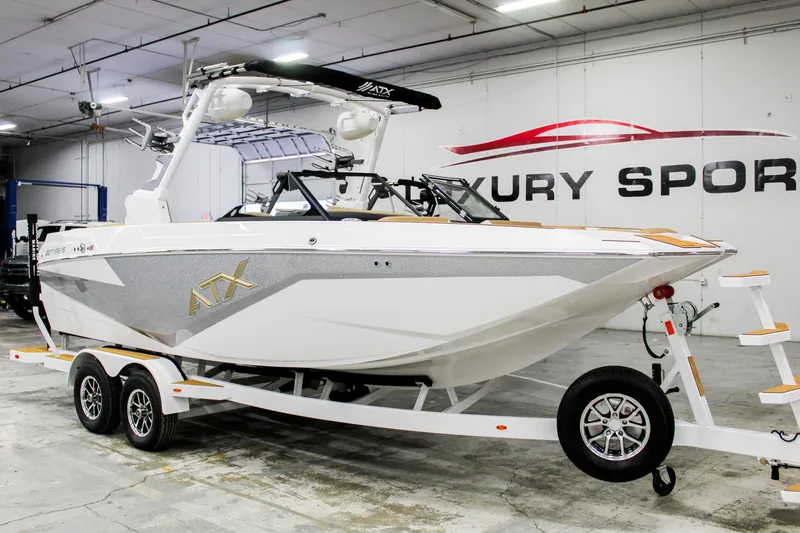 Slide: The Image of 2025 ATX Surf Boats 22 Type-S in showroom, luxury sports design, on trailer. - 6