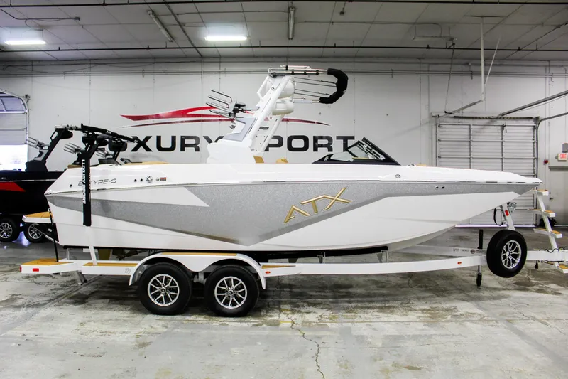 Slide: The Image of 2025 ATX Surf Boats 22 Type-S in showroom, side view, on trailer. - 7
