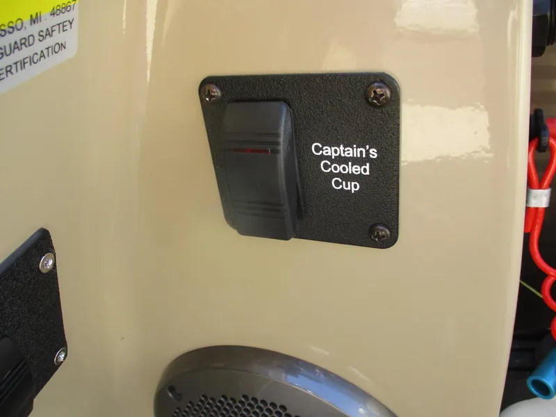 Slide: The Image of Captain's Cooled Cup switch on 2019 Crest FISH 200 C4 boat dashboard. - 13