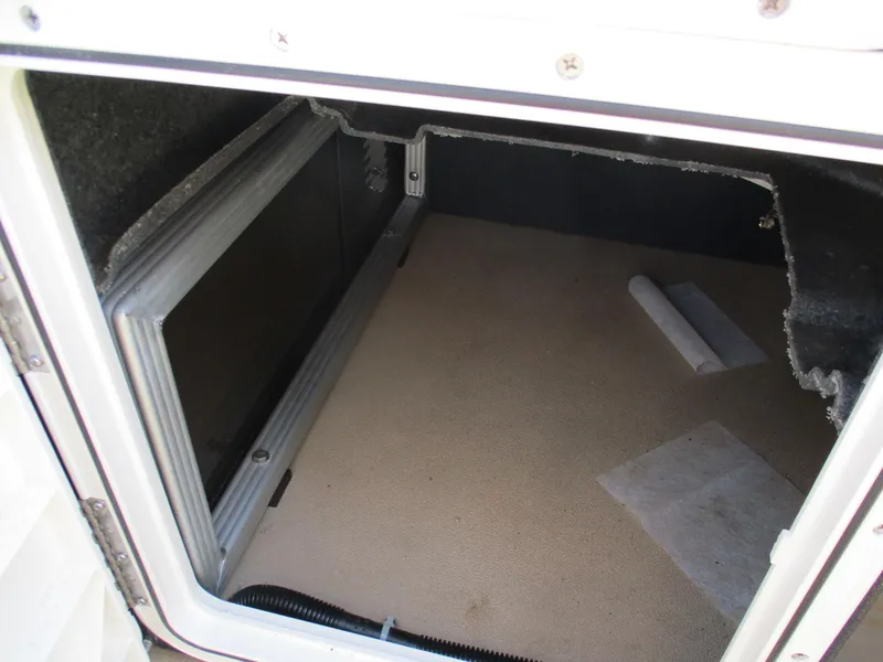 Slide: The Image of Storage compartment of 2019 Crest FISH 200 C4 boat, featuring carpeted interior. - 19