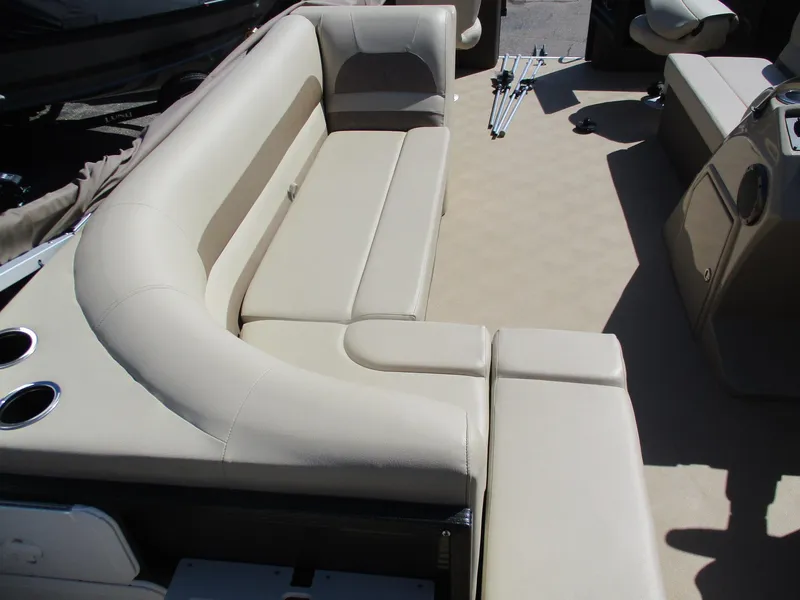 Slide: The Image of 2019 Crest FISH 200 C4 boat interior with beige seating and cup holders. - 2