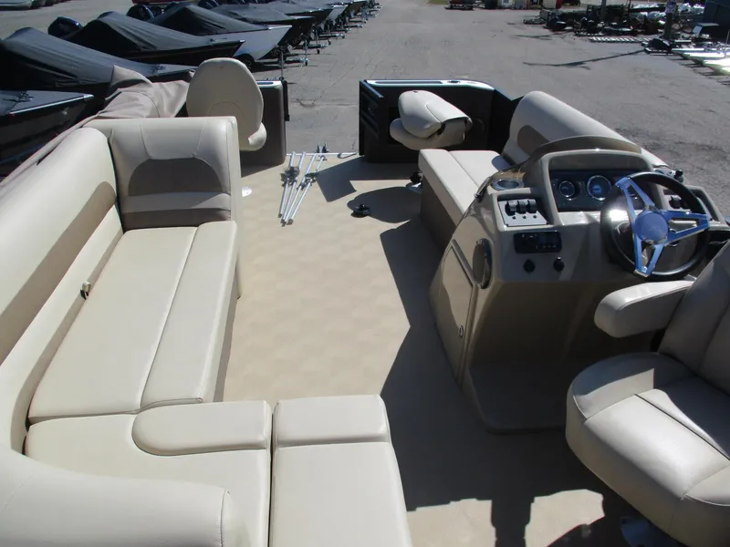 Slide: The Image of Interior of 2019 Crest FISH 200 C4 pontoon boat with beige seating and steering console. - 4