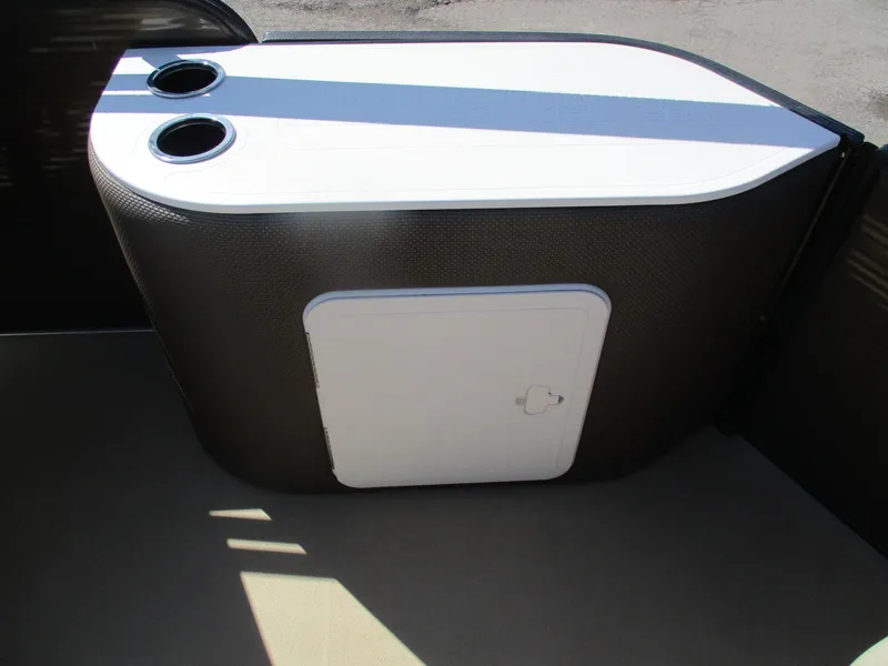 Slide: The Image of 2019 Crest FISH 200 C4 boat interior with cup holders and storage compartment. - 6