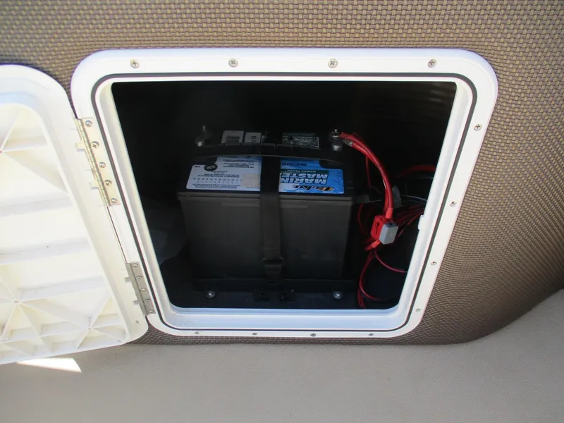 Slide: The Image of Battery compartment of 2019 Crest FISH 200 C4 boat, featuring marine battery and wiring. - 7