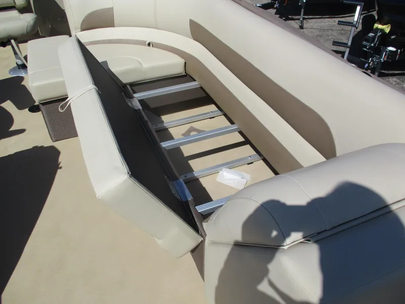 Slide: The Image of 2019 Crest FISH 200 C4 boat interior with beige seating and storage compartment. - 9
