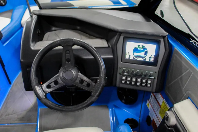 Slide: The Image of 2020 ATX Surf Boats 24 Type-S dashboard with steering wheel and control panel. - 14