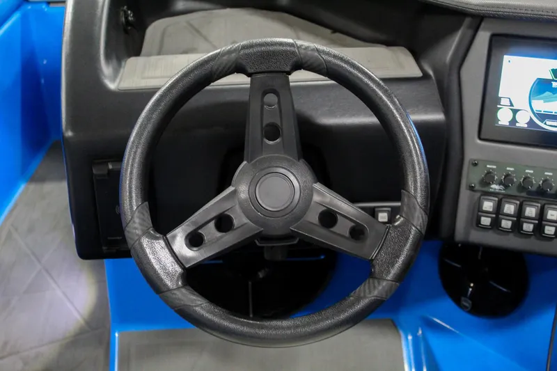 Slide: The Image of Steering wheel of 2020 ATX Surf Boats 24 Type-S with dashboard controls. - 15