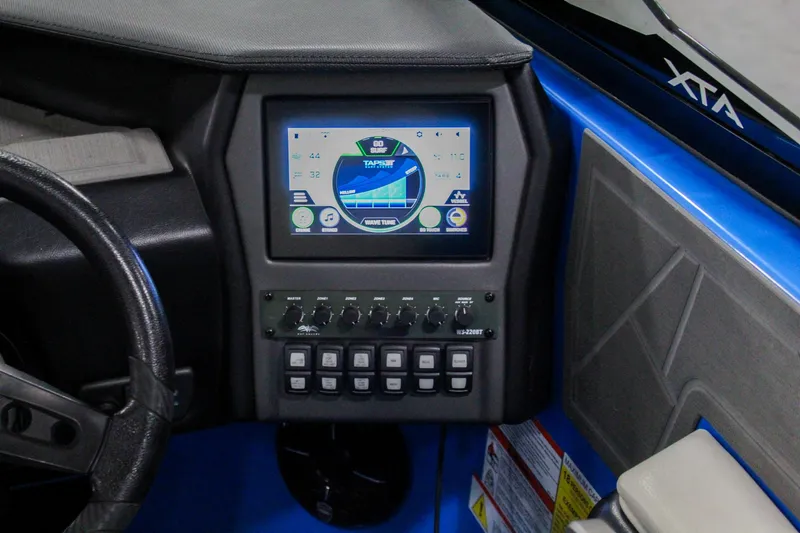 Slide: The Image of Control panel of 2020 ATX Surf Boats 24 Type-S with touchscreen display and switches. - 16