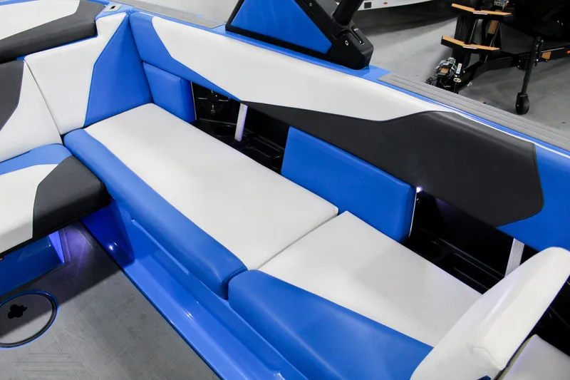 Slide: The Image of 2020 ATX Surf Boats 24 Type-S interior with blue and white seating. - 20