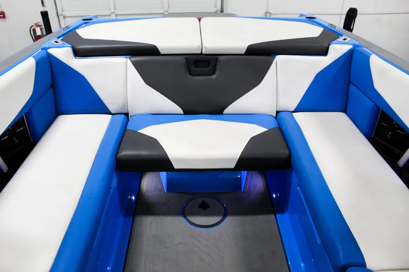 Slide: The Image of 2020 ATX Surf Boats 24 Type-S interior with blue and white seating. - 21