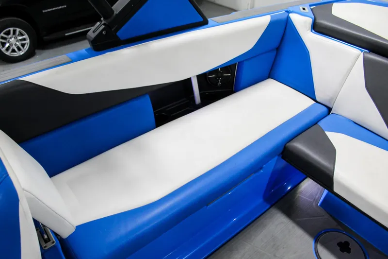 Slide: The Image of 2020 ATX Surf Boats 24 Type-S interior with blue and white seating. - 22