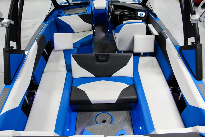 Slide: The Image of 2020 ATX Surf Boats 24 Type-S interior with blue and white seating, modern design. - 23