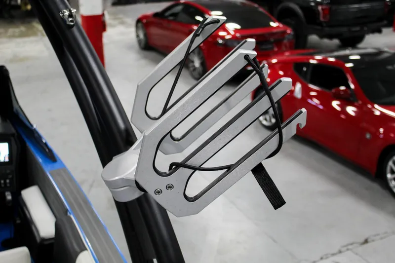 Slide: The Image of ATX Surf Boats 2020 24 Type-S wakeboard rack with cars in the background. - 27