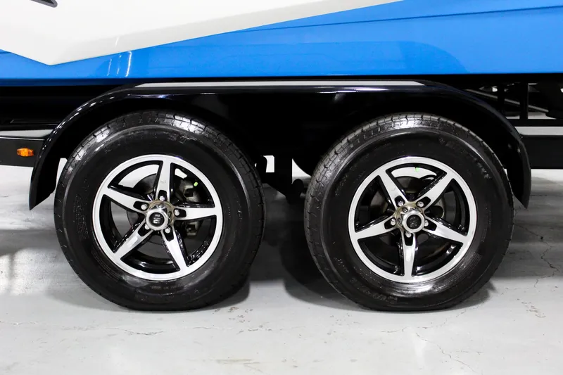 Slide: The Image of Trailer wheels of a 2020 ATX Surf Boats 24 Type-S, featuring sleek black and silver rims. - 29