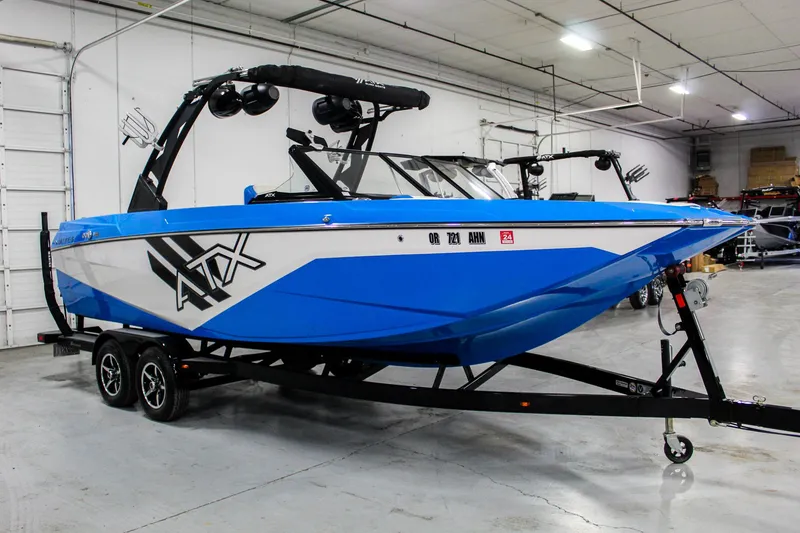 Slide: The Image of 2020 ATX Surf Boats 24 Type-S in a showroom, blue and white design. - 6