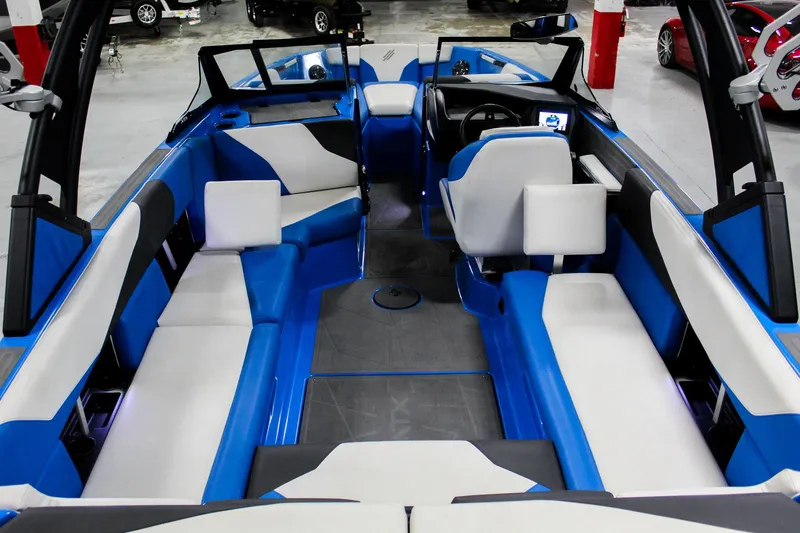 Slide: The Image of 2020 ATX Surf Boats 24 Type-S interior with blue and white seating, modern design. - 8