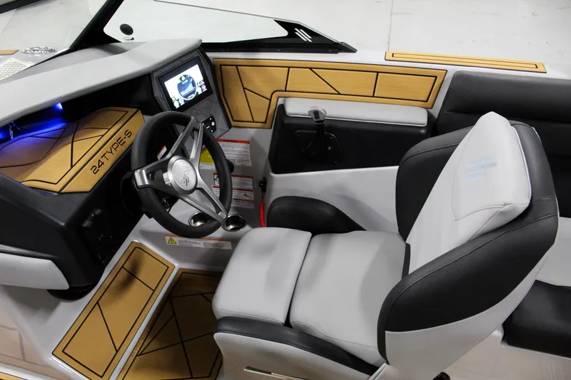 Slide: The Image of 2025 ATX Surf Boats 24 Type-S cockpit with modern steering and dashboard design. - 10