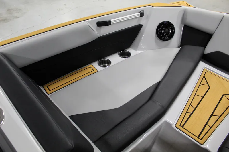 Slide: The Image of Interior seating of 2025 ATX Surf Boats 24 Type-S with cup holders and speaker. - 11