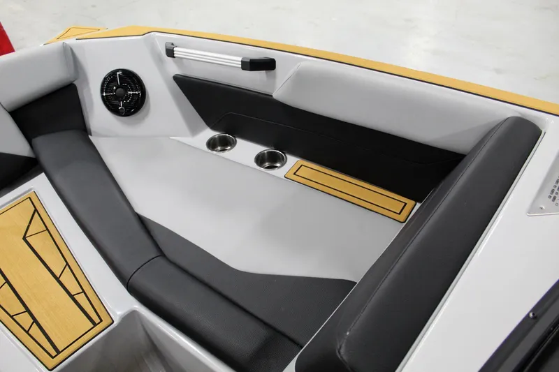 Slide: The Image of 2025 ATX Surf Boats 24 Type-S interior with sleek seating and cup holders. - 12