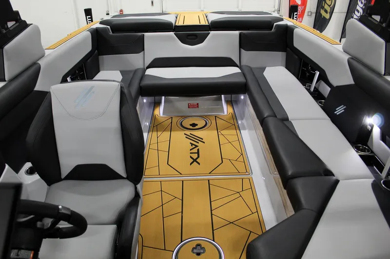 Slide: The Image of 2025 ATX Surf Boats 24 Type-S interior with sleek seating and modern design. - 13