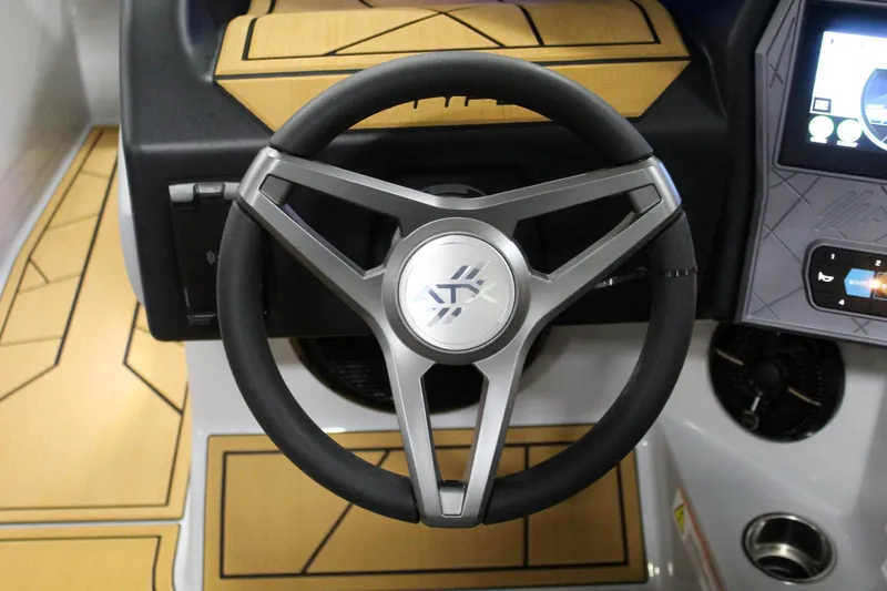 Slide: The Image of Steering wheel of 2025 ATX Surf Boats 24 Type-S with modern dashboard design. - 15