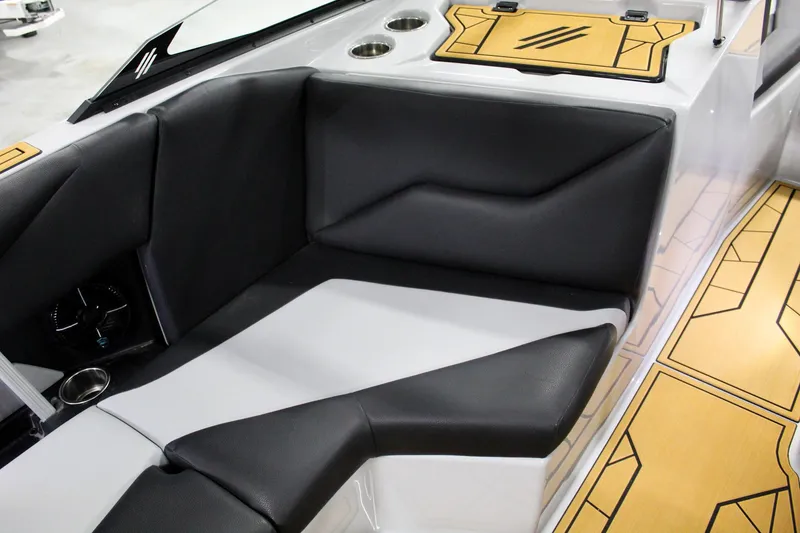 Slide: The Image of 2025 ATX Surf Boats 24 Type-S interior with black and white seating and stylish flooring. - 18