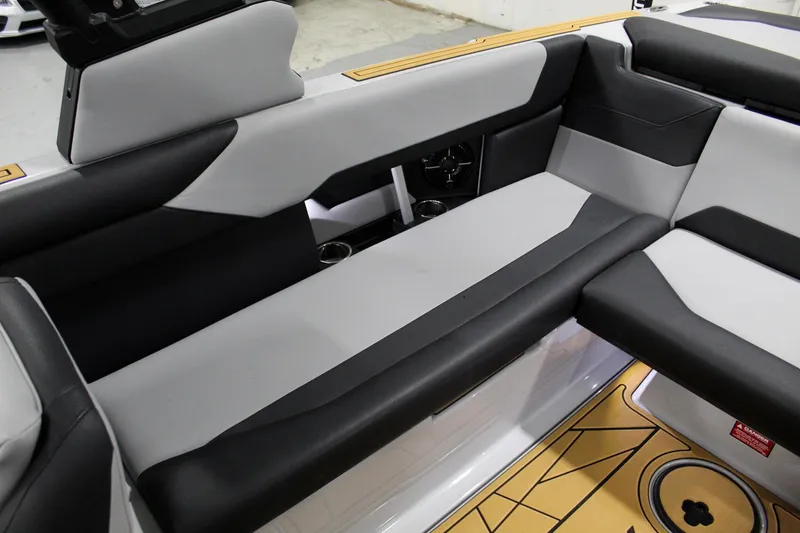 Slide: The Image of 2025 ATX Surf Boats 24 Type-S interior seating with modern black and gray design. - 21