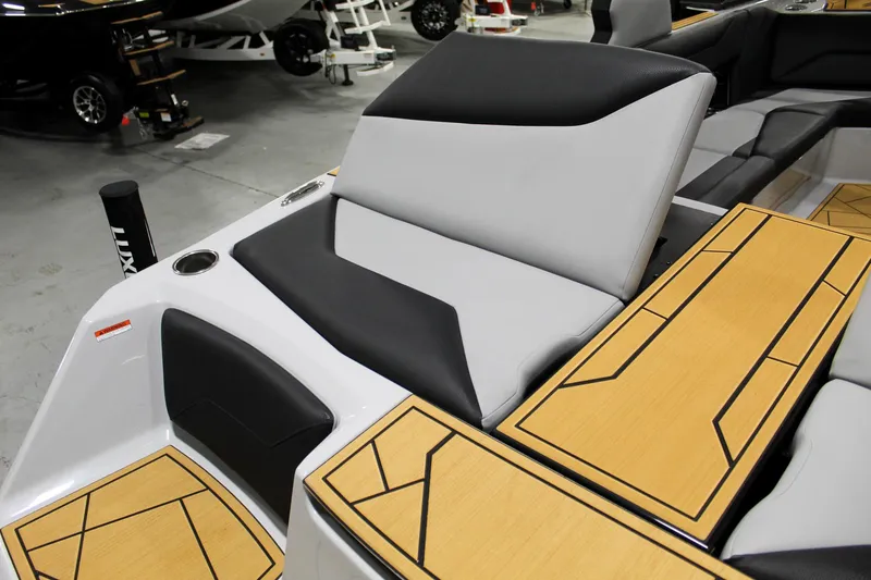 Slide: The Image of 2025 ATX Surf Boats 24 Type-S interior with sleek seating and stylish wood accents. - 26