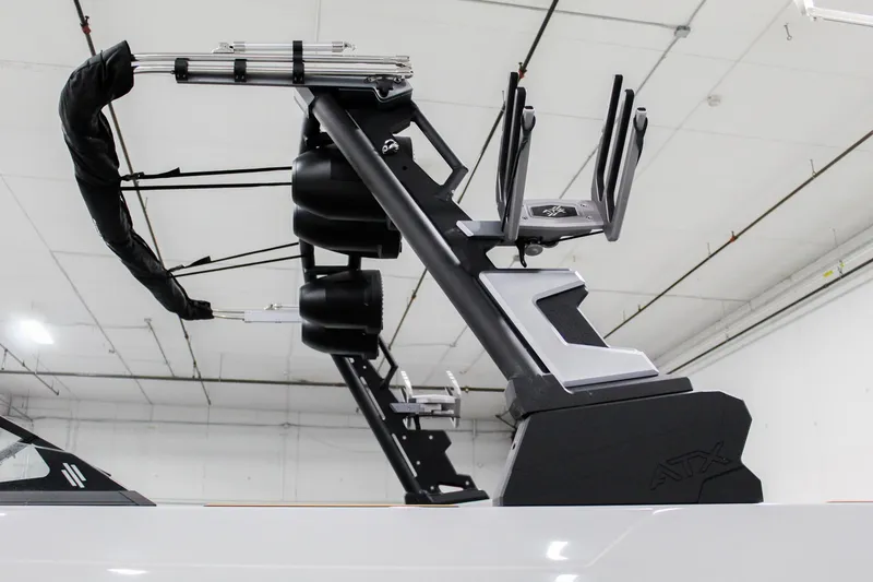 Slide: The Image of 2025 ATX Surf Boats 24 Type-S wakeboard tower in a showroom setting. - 28