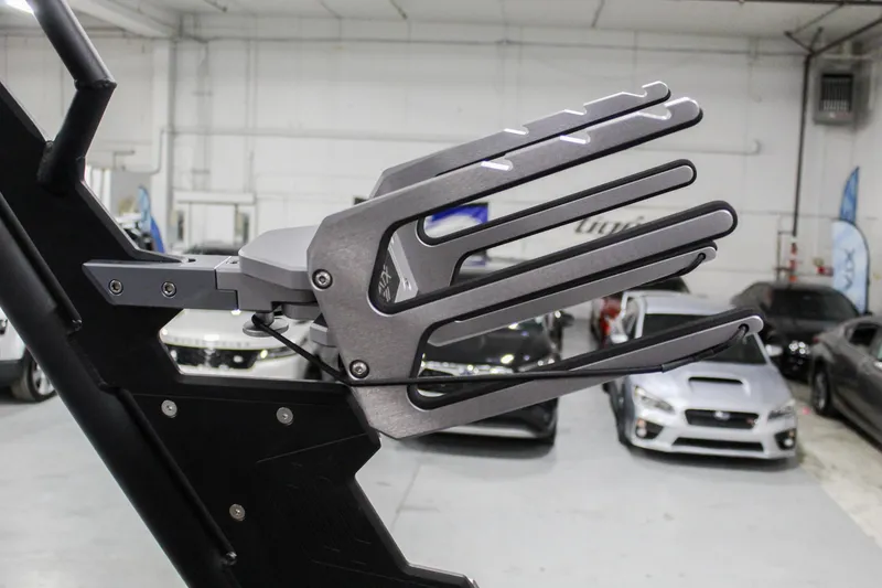 Slide: The Image of 2025 ATX Surf Boats 24 Type-S wakeboard rack in a showroom. - 31