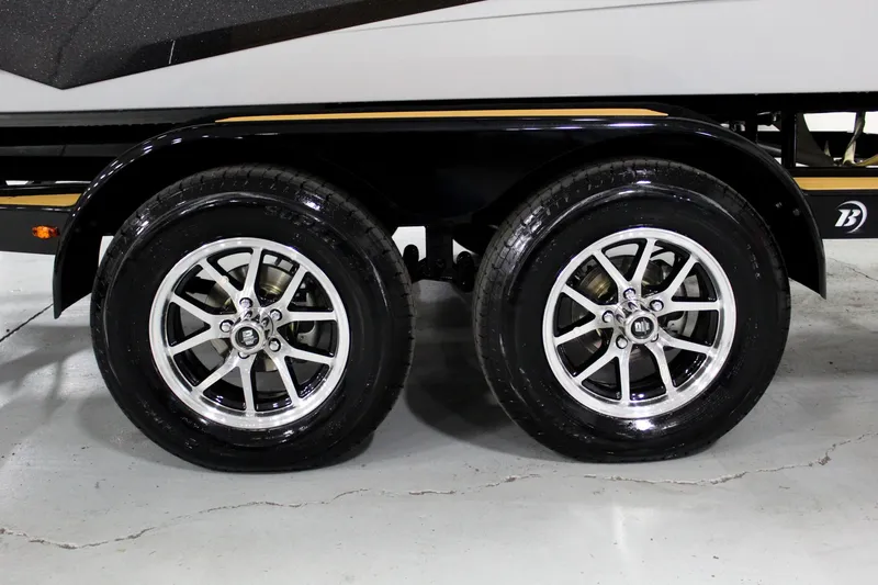 Slide: The Image of Trailer wheels of 2025 ATX Surf Boats 24 Type-S, featuring sleek alloy rims. - 32