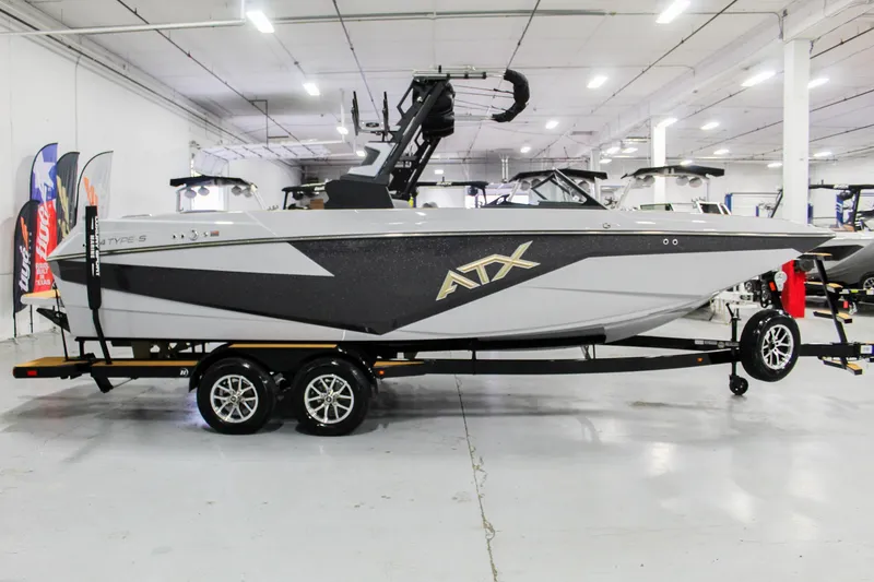 Slide: The Image of 2025 ATX Surf Boats 24 Type-S in showroom, side view on trailer. - 7