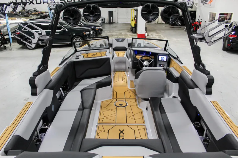 Slide: The Image of 2025 ATX Surf Boats 24 Type-S interior with modern seating and advanced dashboard. - 8
