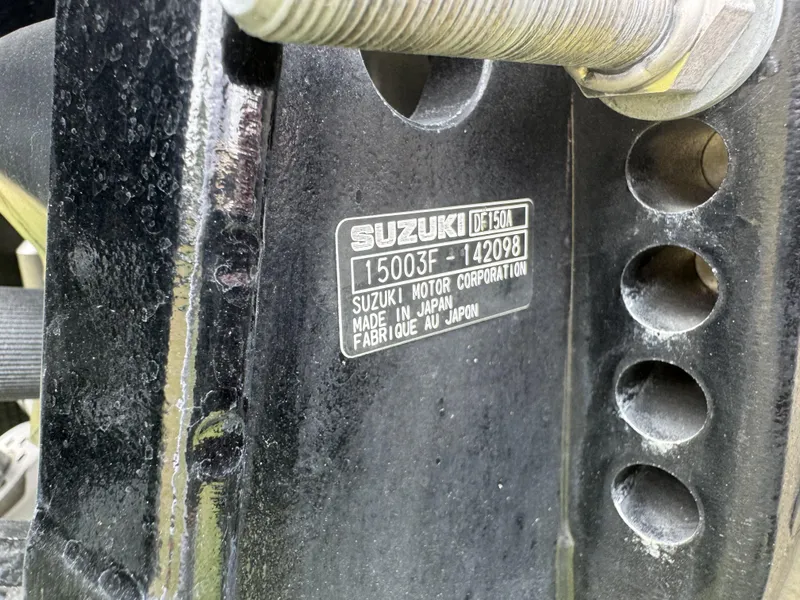 Slide: The Image of Close-up of Suzuki DF150A engine label on Avalon Catalina Rear J Lounger 25', 2021 model. - 19