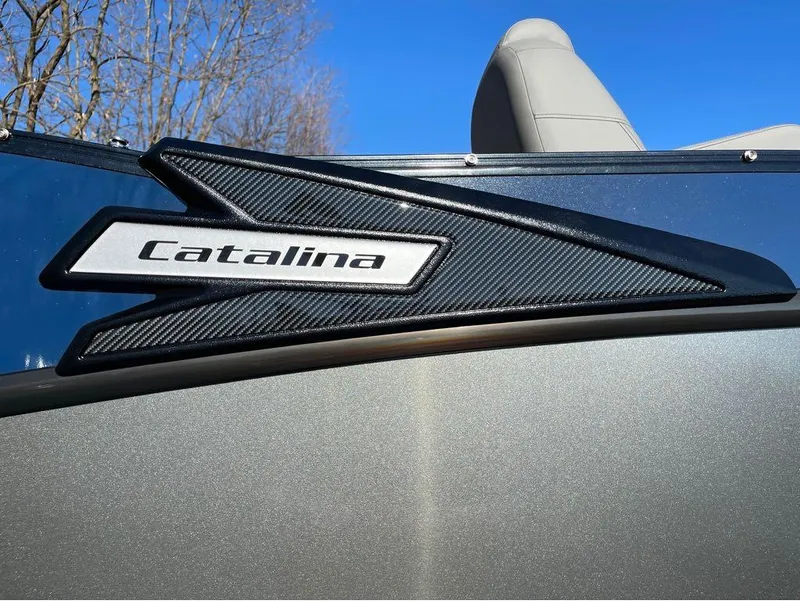 Slide: The Image of 2021 Avalon Catalina Rear J Lounger 25' logo on sleek boat exterior. - 22