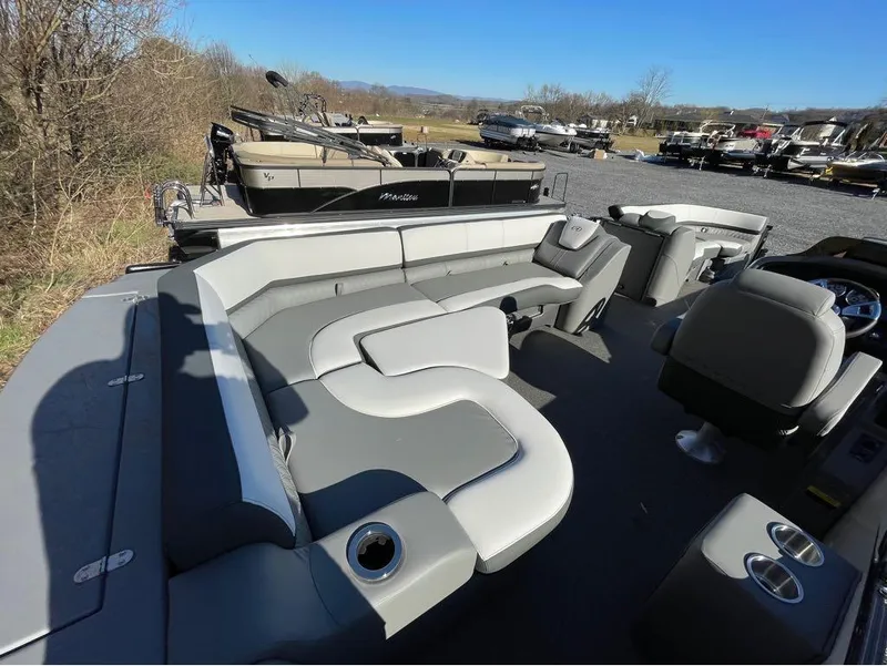 Slide: The Image of 2021 Avalon Catalina Rear J Lounger 25' pontoon boat interior with gray seating and cup holders. - 31
