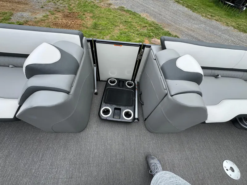 Slide: The Image of 2021 Avalon Catalina Rear J Lounger 25' interior with gray seating and cup holders. - 37