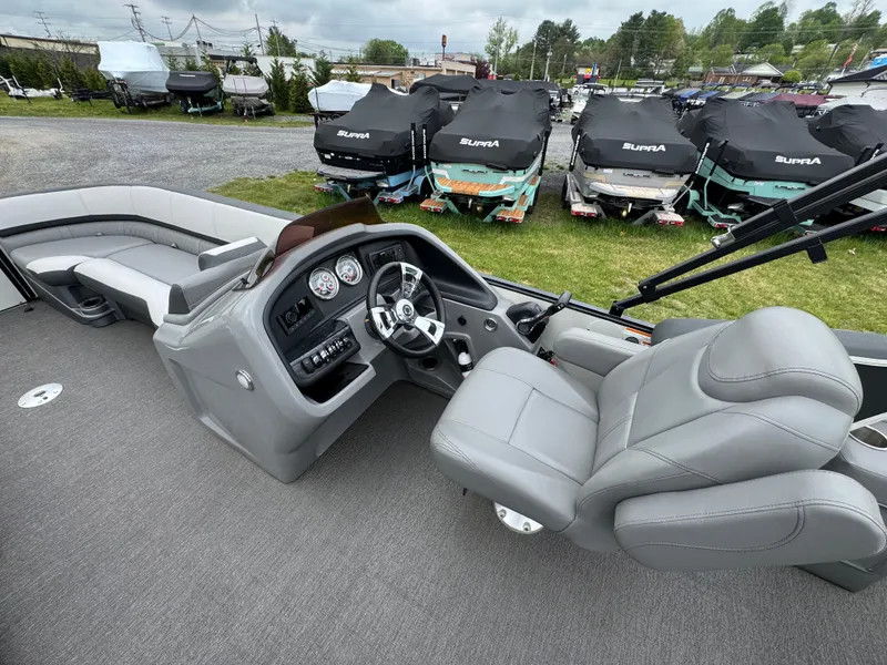 Slide: The Image of 2021 Avalon Catalina Rear J Lounger 25' interior with gray seating and control panel. - 38